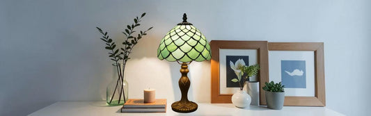 Side by side comparison of Tiffany floor lamp and Tiffany table lamp with stained glass shades