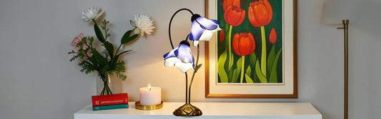 Tiffany stained glass table lamp with warm glowing bulb showing correct wattage lighting effect