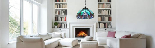 Tiffany stained glass table lamp glowing softly on bedside table in cosy bedroom setting