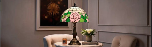 Handcrafted Tiffany rose table lamp with pink and green stained glass shade in elegant living room