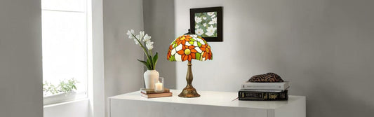 Compact Tiffany stained glass table lamp adding colour and warmth to a small apartment living space