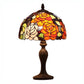 Stained glass table lamp with floral design on a white background. CDH Tiffany Table Lamp