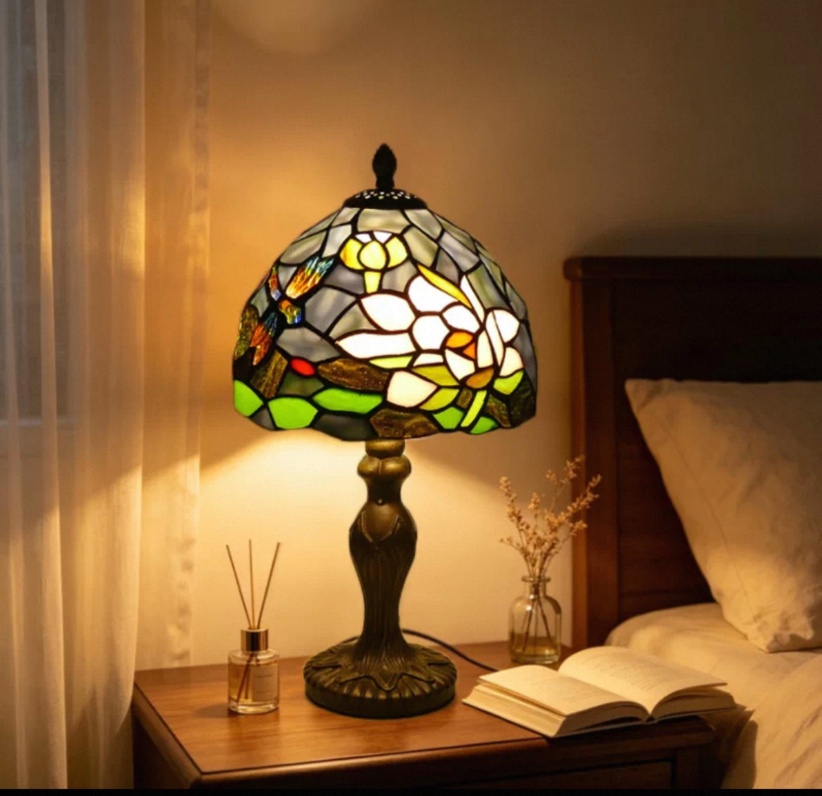 Tiffany-style stained glass table lamp with multicolor shade and bronze base