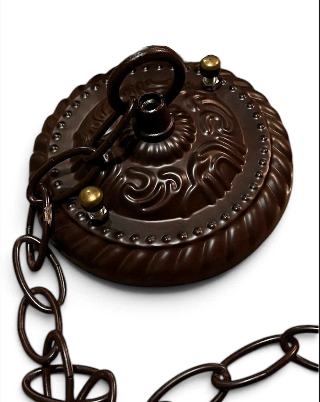 Bronze-brown metal lamp canopy with embossed floral design and chain loop