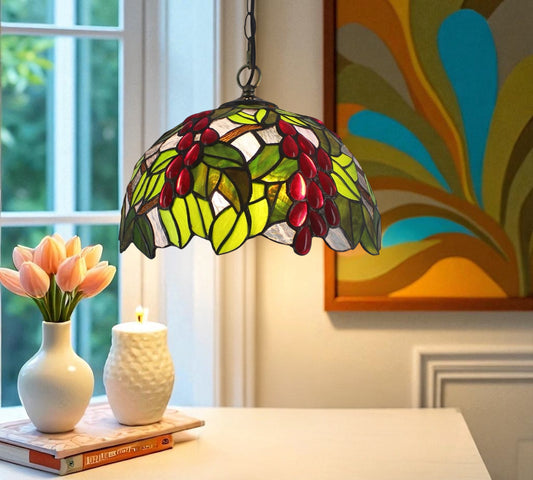 Stained glass pendant lamp featuring red berries, green leaves, and yellow glass shade