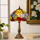 Tiffany table lamp featuring colorful stained glass floral shade and brass-toned base