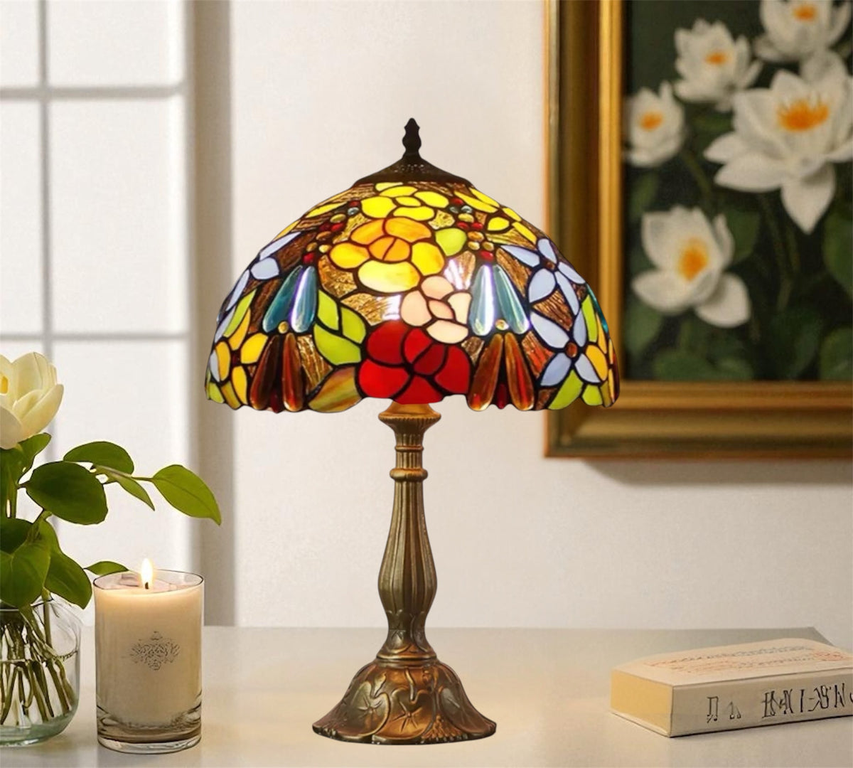 Tiffany table lamp featuring colorful stained glass floral shade and brass-toned base