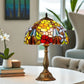 Tiffany stained glass table lamp with domed floral shade and bronze metal base