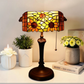 Tiffany reading table lamp with stained-glass sunflower shade and dark metal base