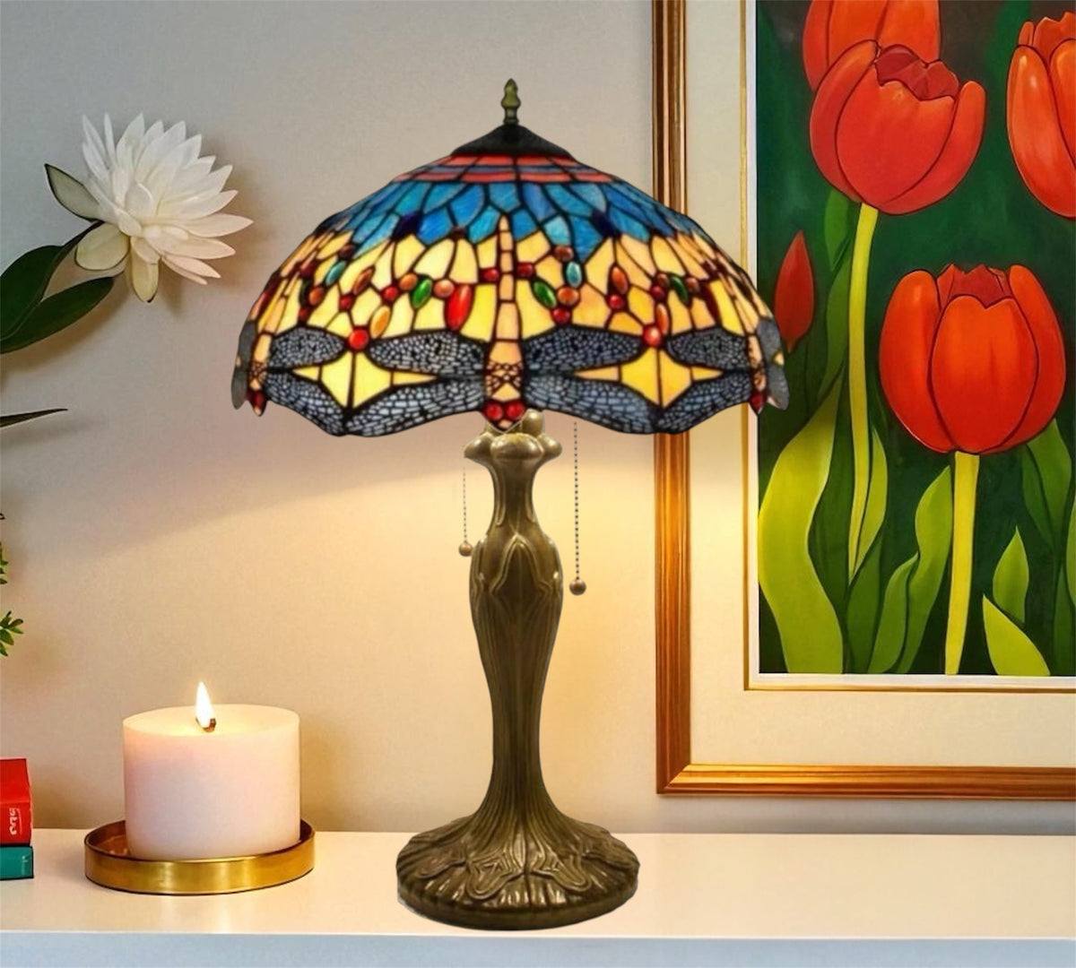 Tiffany-style table lamp with multicolor stained glass shade and bronze base, pull-chain detail
