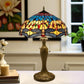 Stained-glass table lamp with blue/red/yellow dome shade, brass base, hanging pull chain