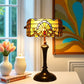 Stained glass table lamp with amber shade and bronze base, round domed finial