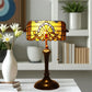 Stained glass table lamp with amber shade and bronze pedestal base