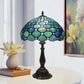Tiffany table lamp with teal/blue stained-glass hex shade and dark metal pedestal base