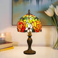 Tiffany-style stained glass table lamp with multicolor dome shade and dark bronze base