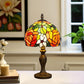 Tiffany-style stained glass table lamp with multicolor dome shade and detailed dark base