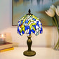 Tiffany table lamp with dome stained glass shade in blue, yellow, and white; bronze base