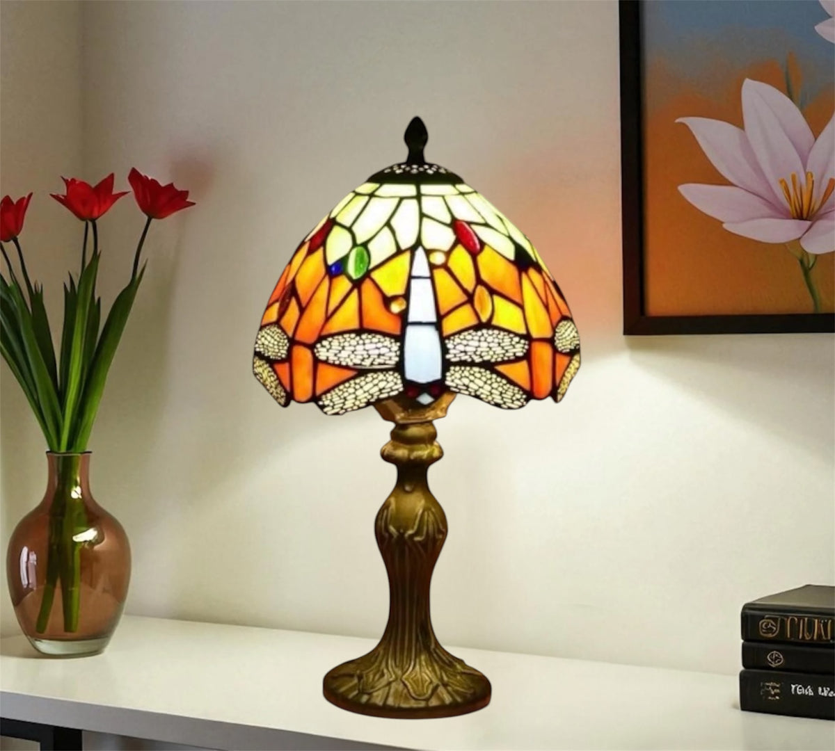 Tiffany-style table lamp with multicolor stained glass shade and decorative bronze-toned base