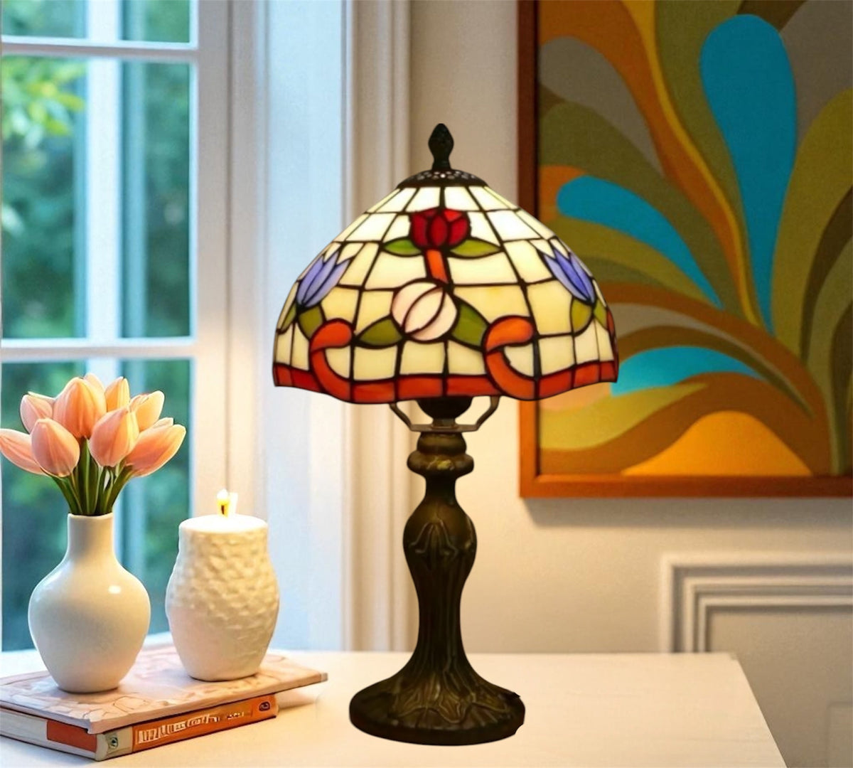 Tiffany-style stained glass table lamp with floral shade, bronze base, and pull-cord switch.