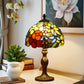 Tiffany-style stained glass table lamp with dome shade in yellow, orange, and red
