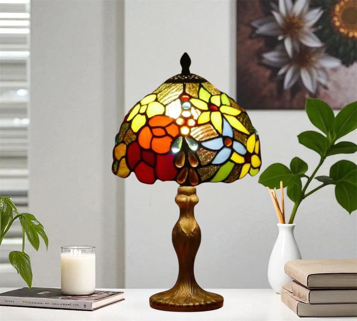 Tiffany-style table lamp featuring multicolor stained glass dome shade on a metal base