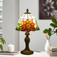 Tiffany-style stained glass table lamp with orange flower shade and ornate dark bronze base