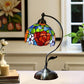 Stained glass floral table lamp with multicolor rose shade and arched metal pedestal base