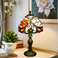 Tiffany table lamp with multicolor stained-glass dome shade and dark bronze stand
