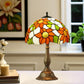 Tiffany-style table lamp with multicolor stained-glass floral shade and bronze base