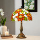 Tiffany-style table lamp with stained-glass floral shade and bronze ornate base