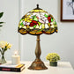 12-inch Tiffany-style table lamp with multicolor stained-glass shade and bronze base