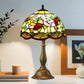 Tiffany table lamp with multicolor stained-glass dome shade and bronze metal base