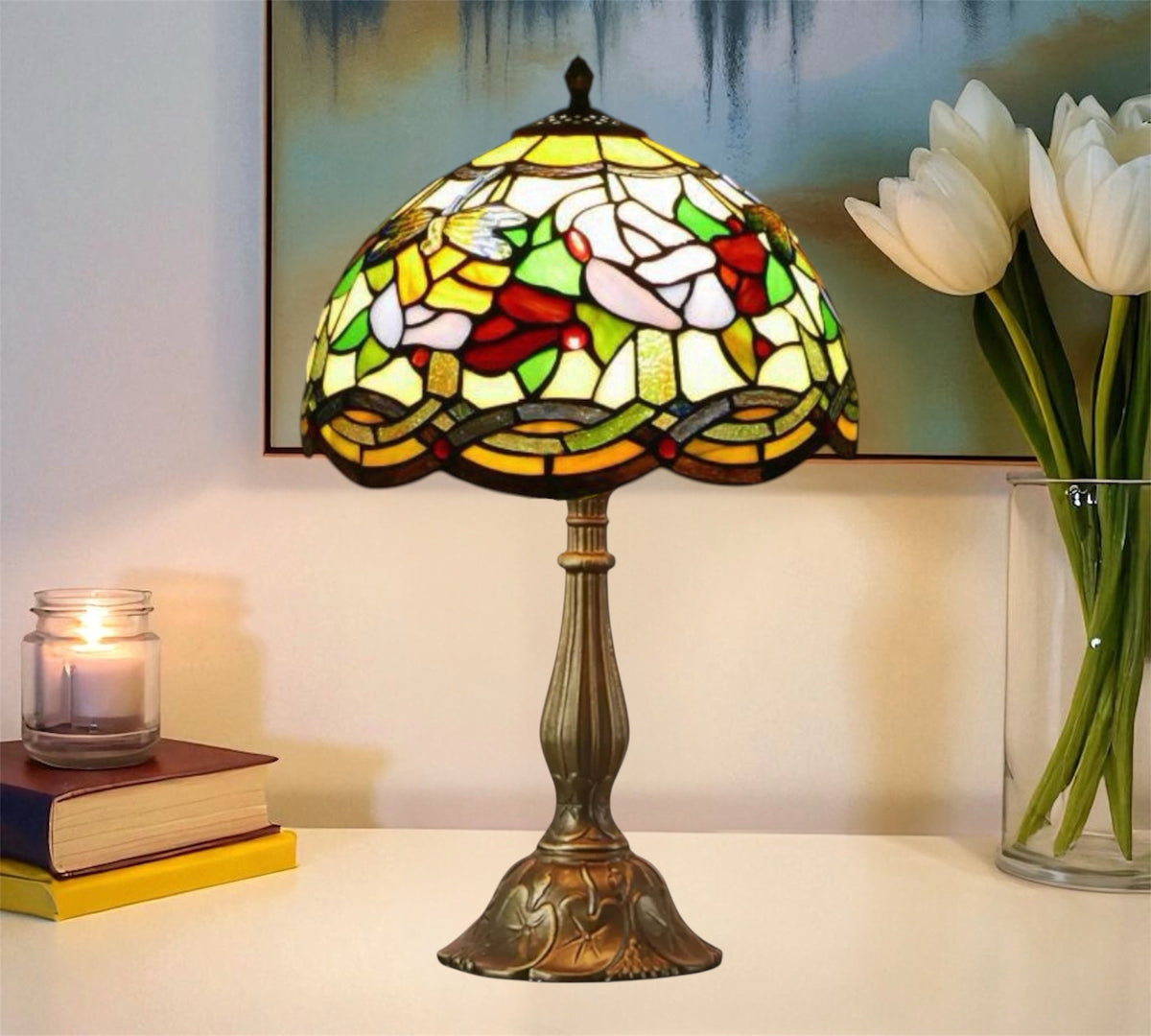 Tiffany-style table lamp with multicolor stained-glass shade and bronze pedestal base