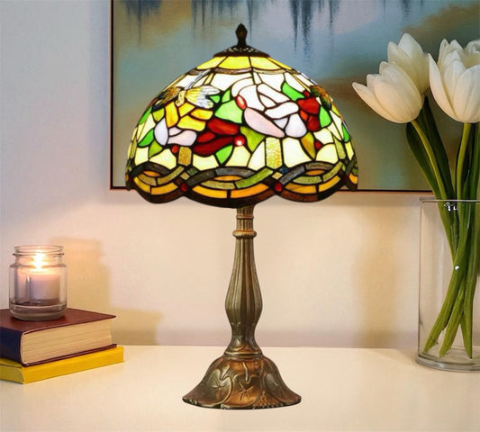 Tiffany-style table lamp with multicolor stained-glass shade and bronze pedestal base