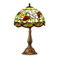 Tiffany-style table lamp with multicolor stained-glass shade and bronze base