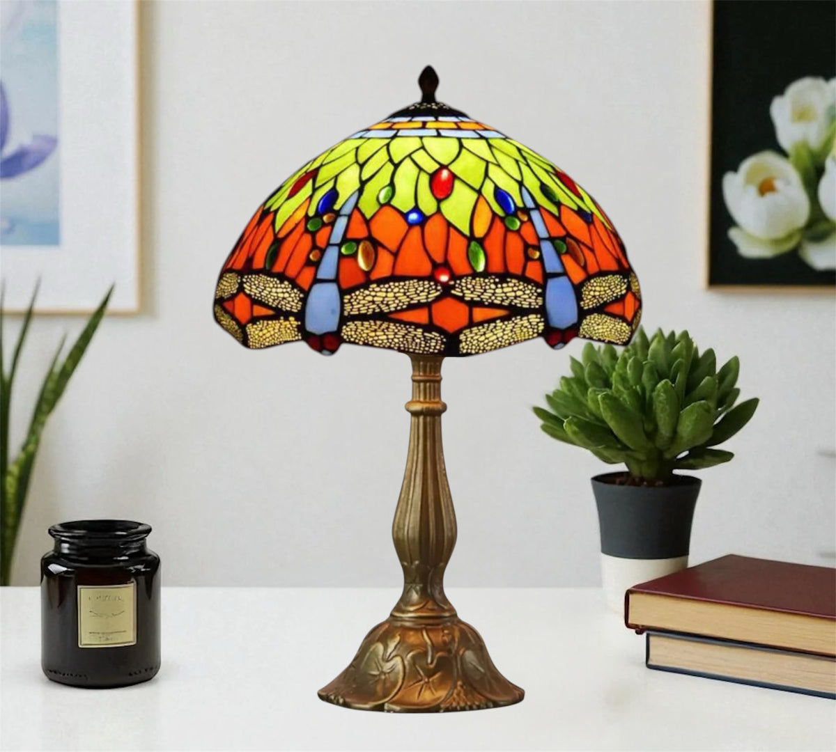 Stained glass table lamp with domed multicolor shade and sculpted bronze base