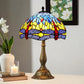 Tiffany-style stained glass table lamp with colorful dome shade and bronze metal base