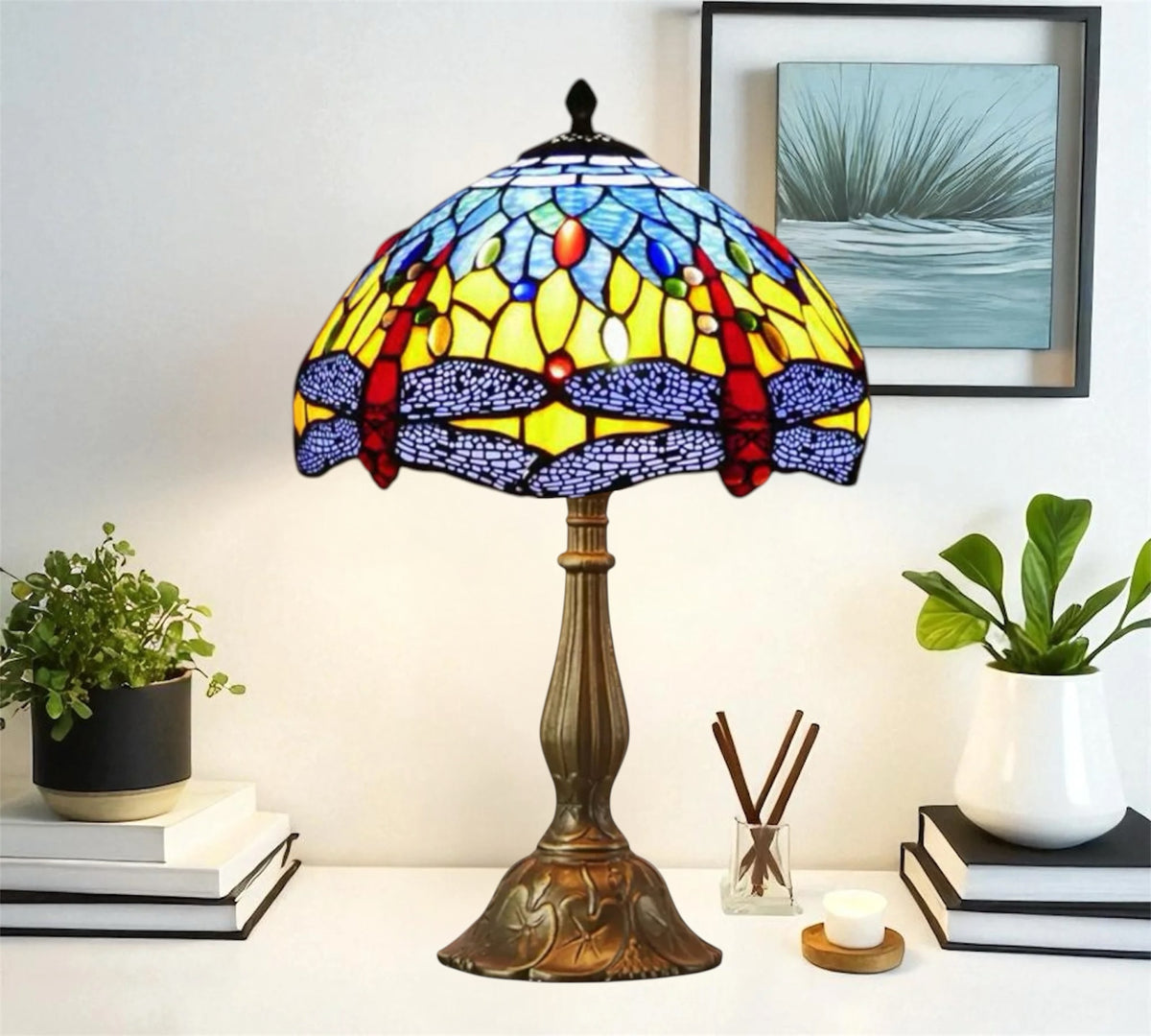 Tiffany table lamp featuring multicolor stained glass dome shade and bronze column base