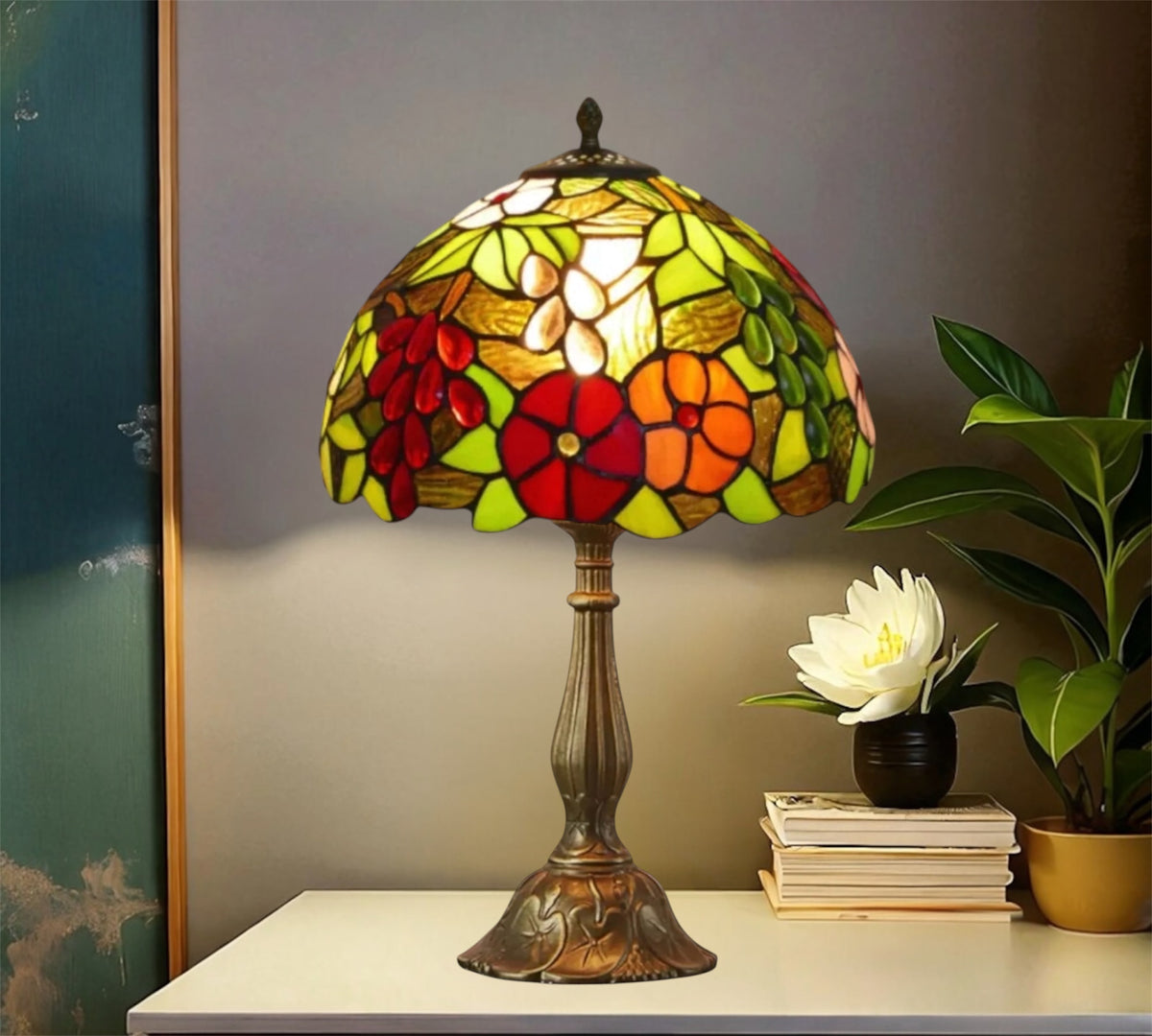 Stained glass table lamp with multicolor floral shade and tall bronze pedestal base