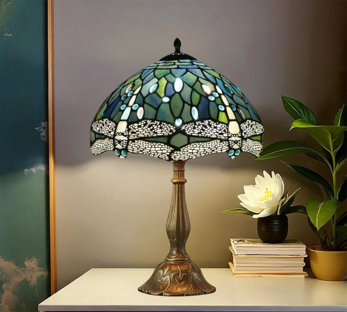 Tiffany stained glass table lamp with green-blue shade and detailed bronze foot