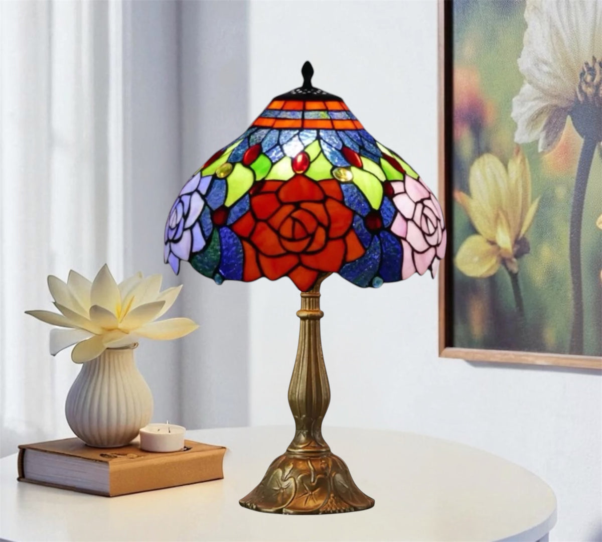 Stained glass table lamp with red rose shade, multicolor panels, bronze base, black finial.