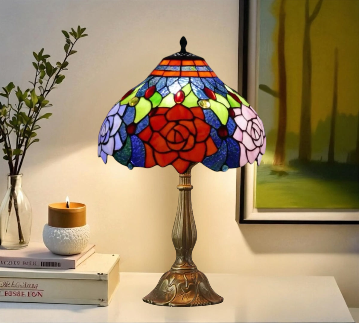 Stained glass Tiffany-style table lamp with floral rose shade and bronze metal base.