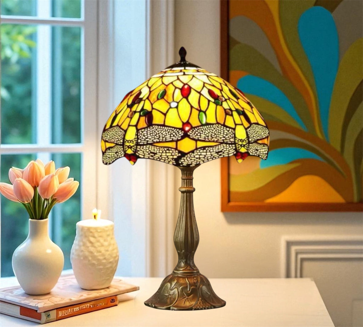 Tiffany-style stained glass table lamp with multicolor shade on a bronze metal base
