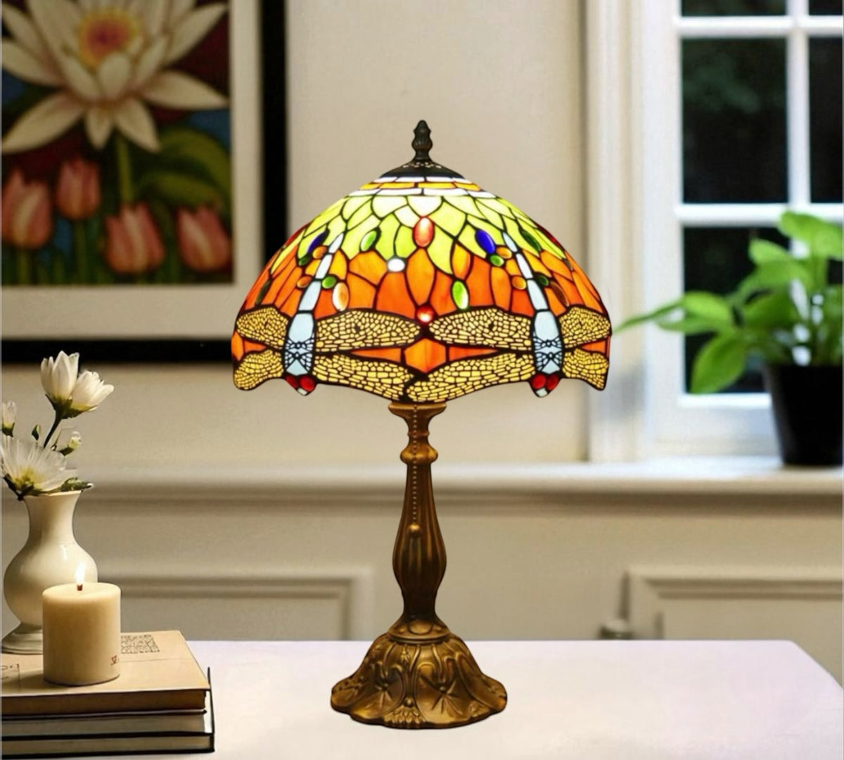Tiffany table lamp with multicolor stained-glass shade and bronze base on a tabletop.
