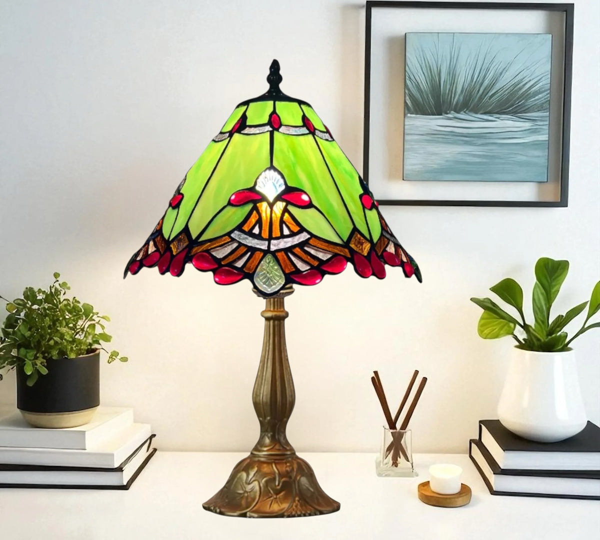 Green stained-glass Tiffany table lamp shade with bronze weighted base
