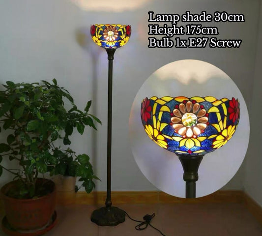 Stained glass floor lamp with multicolor floral shade on tall dark base