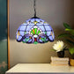 Stained glass pendant lamp with blue shade, multicolor floral pattern, and dark chain