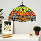 Tiffany-style stained glass pendant lamp overhead view of multicolor mosaic dome shade