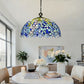 Stained glass pendant lamp shade with blue, yellow, and white mosaic tiles on black chain