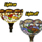 Stained-glass torchiere lamp shade close-up, illuminated vs unlit, dark metal stem